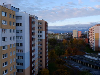 Exterior of buildings in town against sky