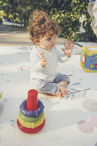 Cute boy playing with toy