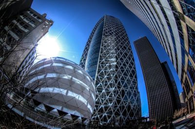 Low angle view of modern building against blue sky