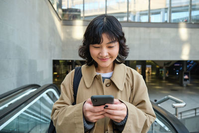 Young woman using mobile phone