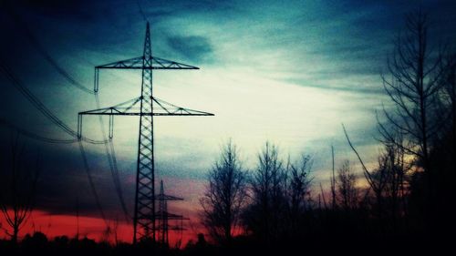 Low angle view of windmill against sky