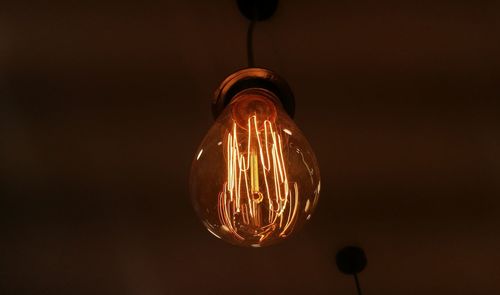 Low angle view of illuminated light bulb