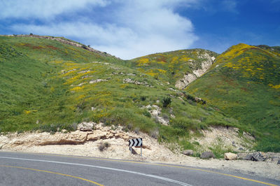 Scenic view of mountain road against sky