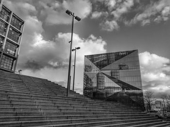 Low angle view of staircase by building against sky