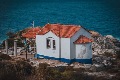 Exterior of houses in front of sea