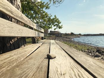 Footpath by river against sky