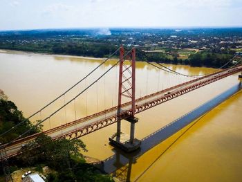 Suspension bridge over river in city