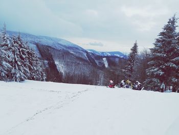 Scenic view of snow covered mountains against sky