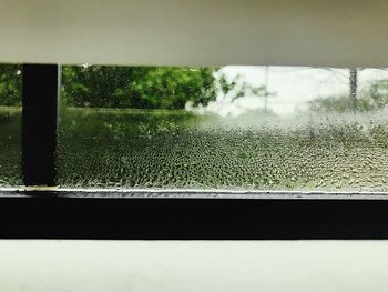 Close-up of wet window in rainy season