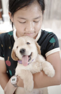 Close-up of girl with dog