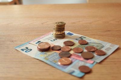 High angle view of coins on table