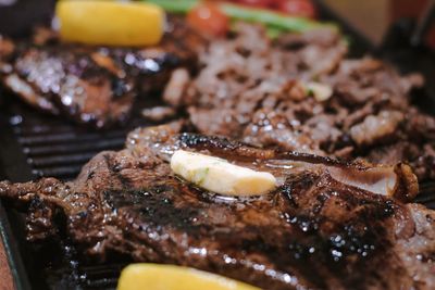 Close-up of meat on barbecue grill