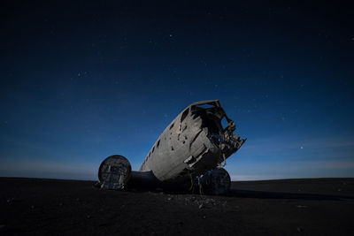 Abandoned built structure against sky at night