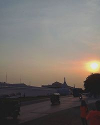 Car on road at sunset
