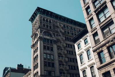 Low angle view of buildings against clear sky