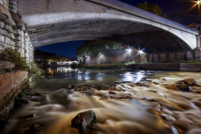 Below view of bridge over river against sky