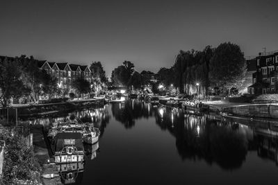 Scenic view of river against sky at night