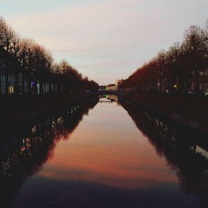 View of canal at sunset