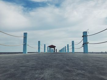 Surface level of suspension bridge against sky