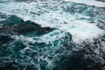 High angle view of waves in sea