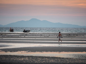 Silhouette of woman at sunset