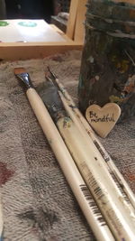 Close-up of paintbrushes on table