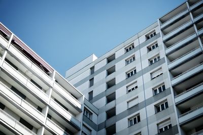 Low angle view of building against clear blue sky