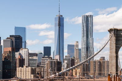 Brooklyn bridge against manhattan skyline