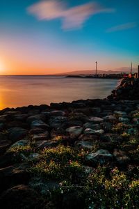 Scenic view of sea against sky at sunset