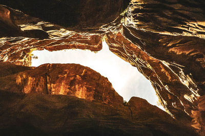 Low angle view of rock formations against mountains