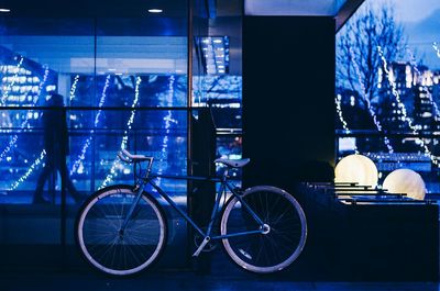 View of bicycle parked against blue wall