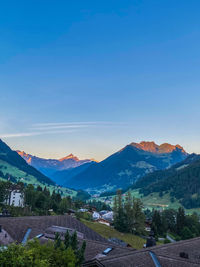 Scenic view of mountains against blue sky