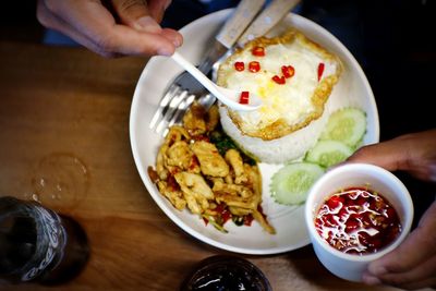 High angle view of person having food at table