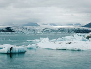 Scenic view of frozen lake against sky