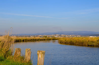 Scenic view of lake against blue sky