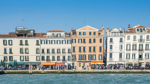 View of buildings against blue sky