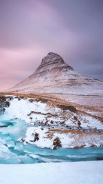 Scenic view of snowcapped mountain against sky