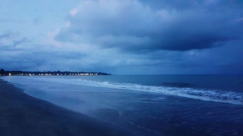 Scenic view of sea against sky at dusk