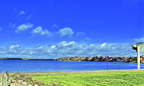 Scenic view of sea against blue sky