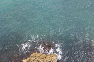 Waves splashing on rocks