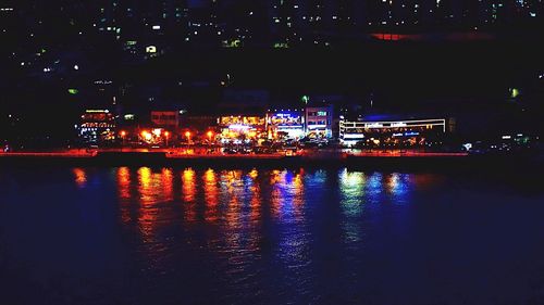 Reflection of illuminated buildings in water