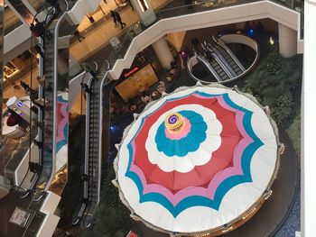 High angle view of multi colored umbrellas in city