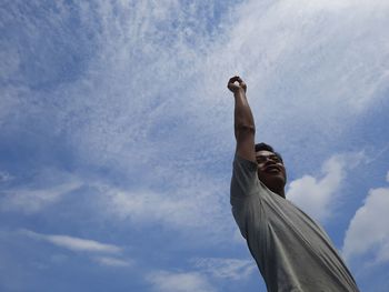 Low angle view of statue against blue sky