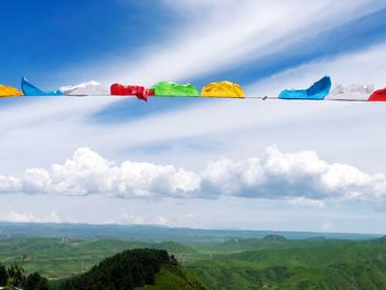 Prayer flags hanging on the mountain blue sky scenery