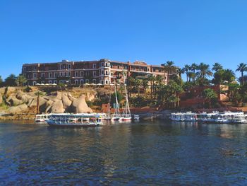 Scenic view of river against clear blue sky