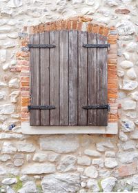 Brick wall with closed door