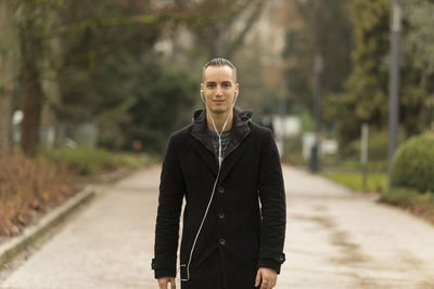 Portrait of smiling man standing outdoors