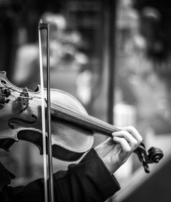 Cropped hand playing violin