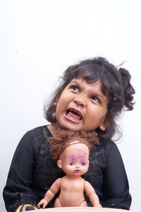 Portrait of happy girl against white background