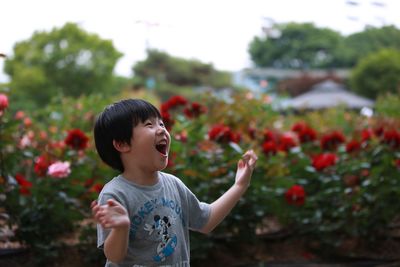 Cute happy boy playing in park